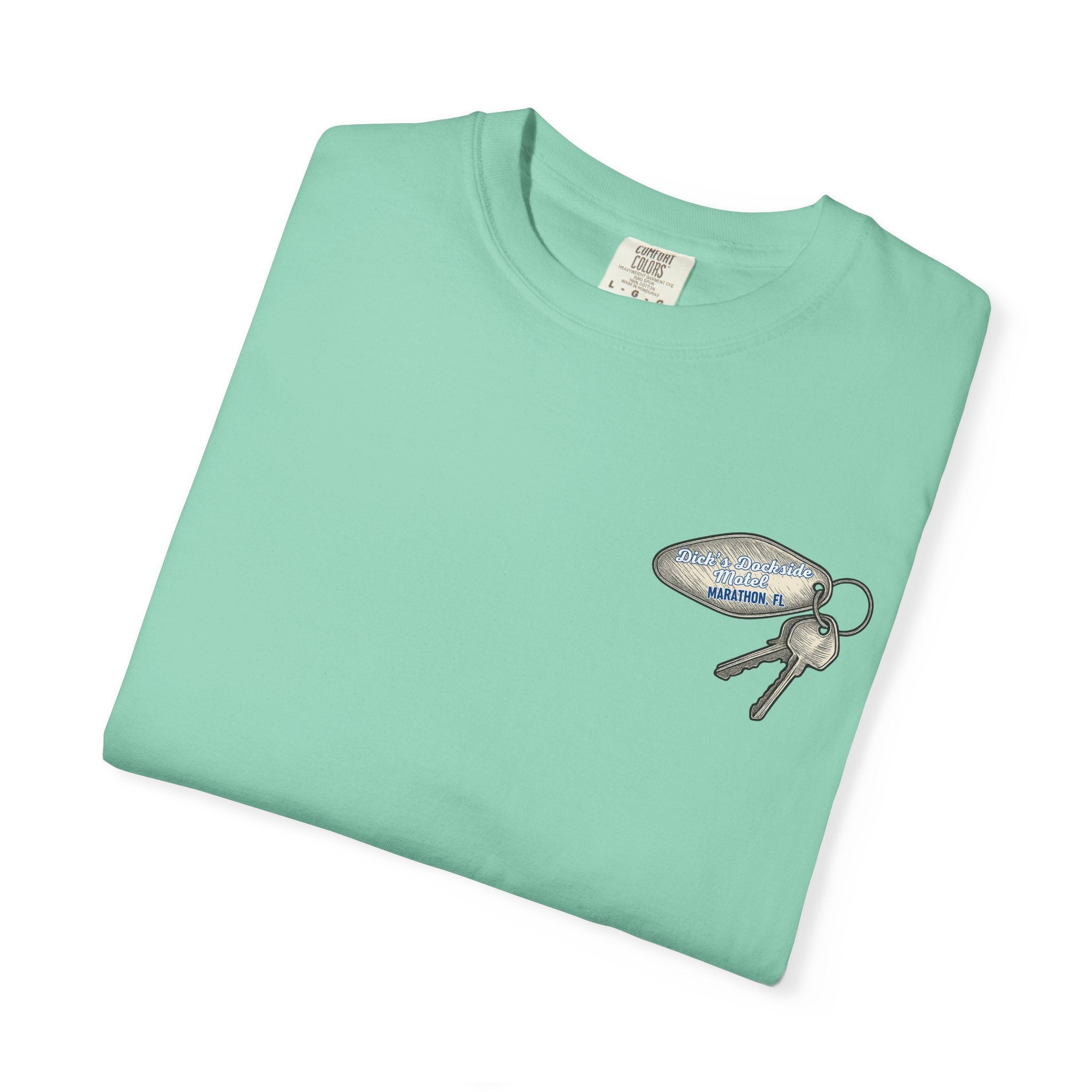 Folded light green t-shirt with a keychain graphic on a white background