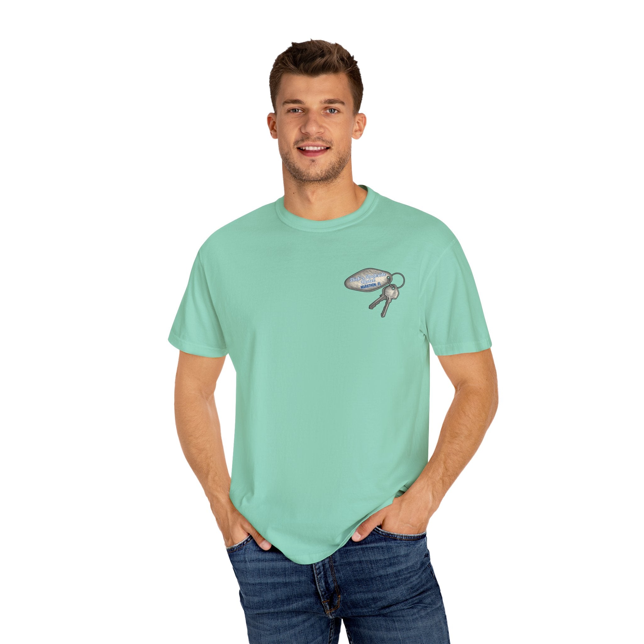 Man wearing a light green t-shirt with a graphic design on a white background